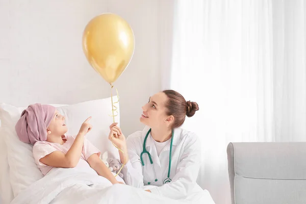 depositphotos_423108276-stock-photo-doctor-golden-balloon-little-girl.webp.webp