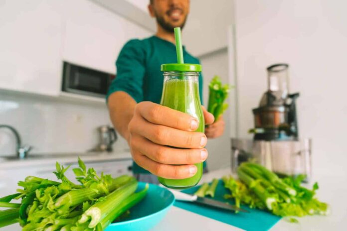 man-with-bottle-of-fresh-detox-homemade-celery-juice.jpg